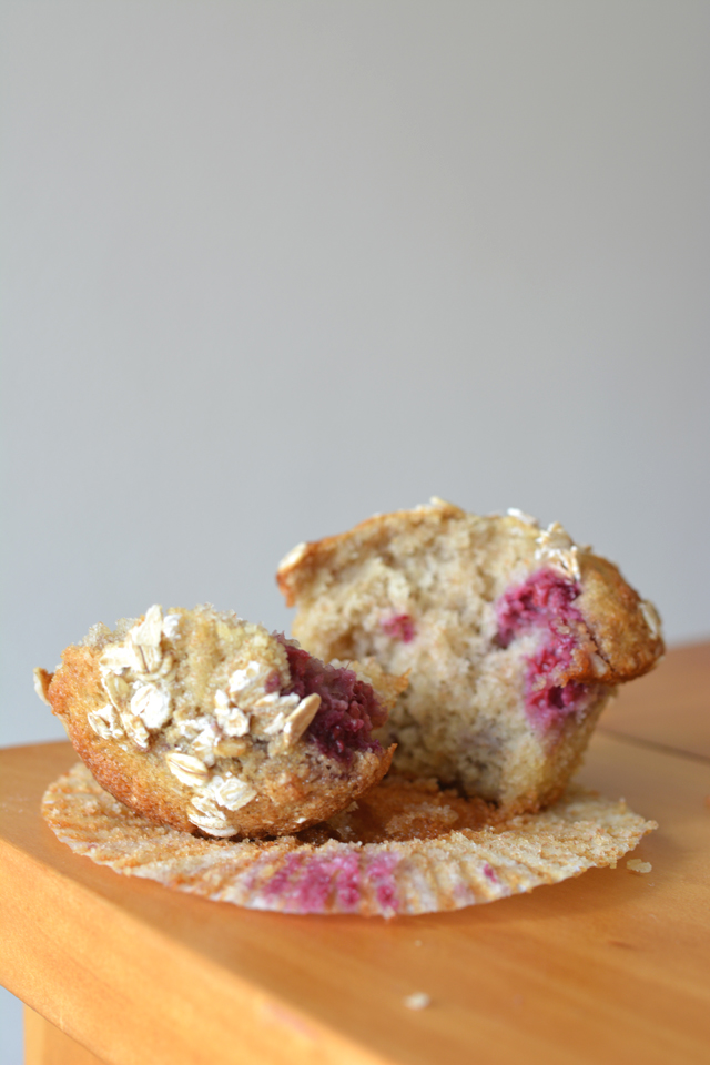 Close-up image of a halved Raspberry Coconut Muffin showcasing its enticing texture and fruity-raspberry filling.