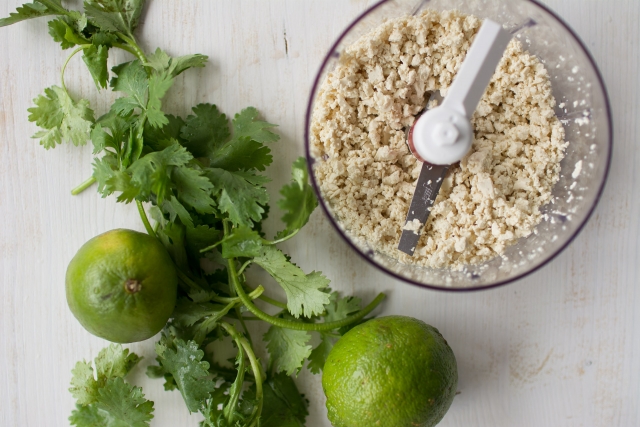 Small Bunch of Coriander and basmati rice with lime in a grinder