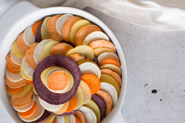Layered slices of potatoes in a dish.