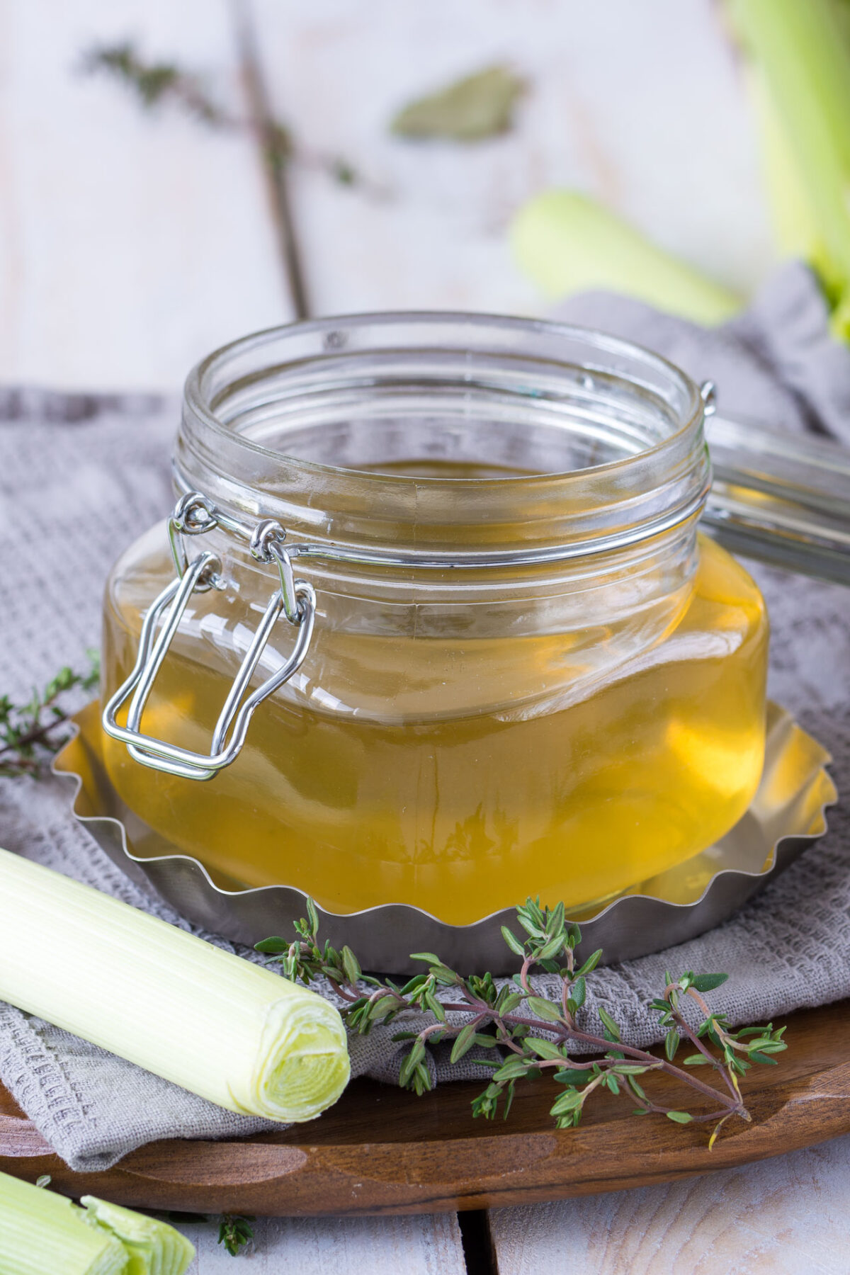 close-up image showcasing a glass canister filled with flavorful homemade vegetable stock