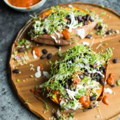 Loaded Sweet Potatoes with Quinoa Tabbouleh. Healthy and totally vegan, these baked sweet potatoes are topped with fresh, vibrant ingredients for a great, satisfying meal!