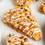 Close-up view of an Ingredients for orange date oatmeal scone with sweet glaze applied.